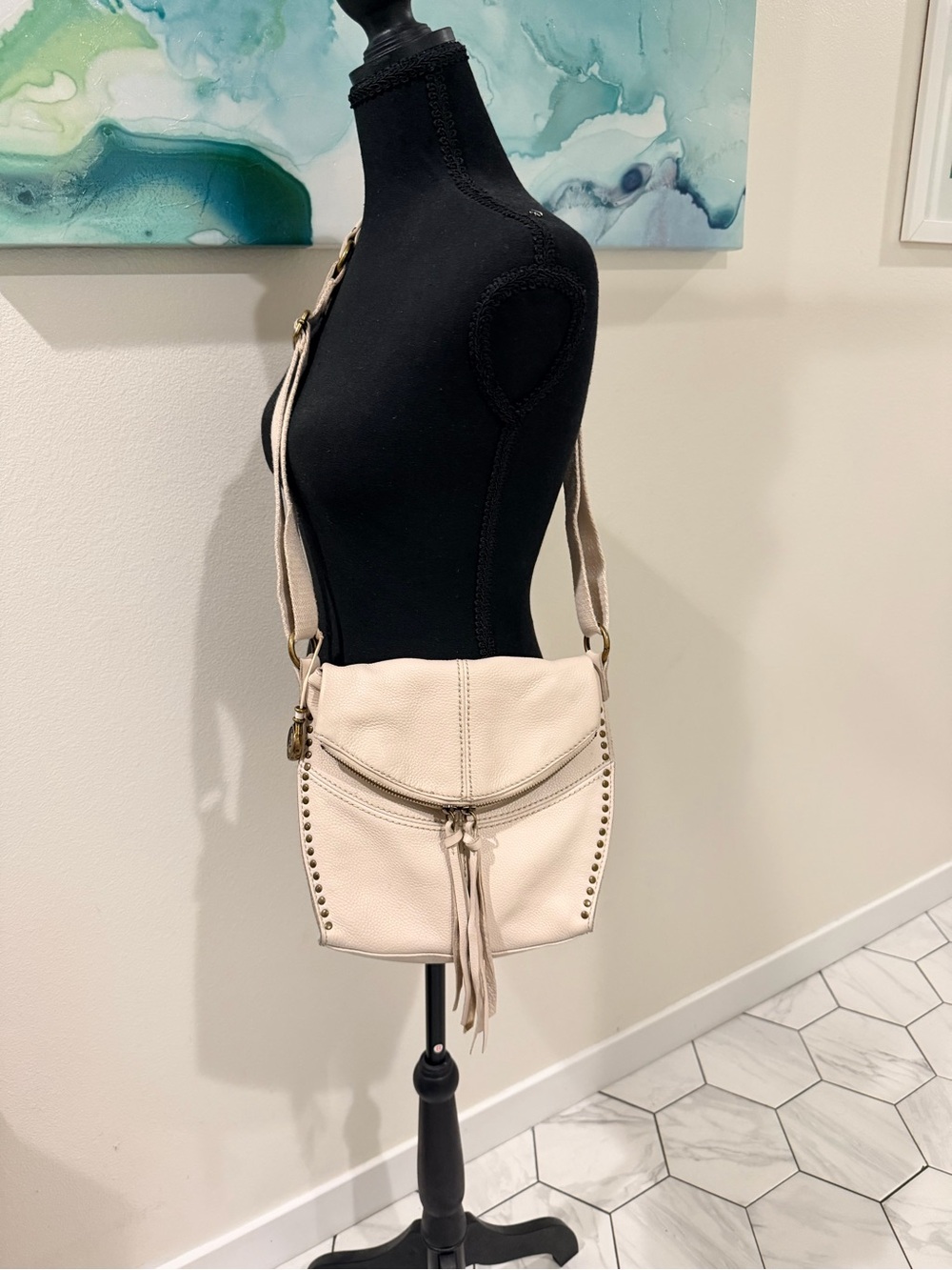 The Sak Cream Leather Crossbody with Stud & Tassel Detail